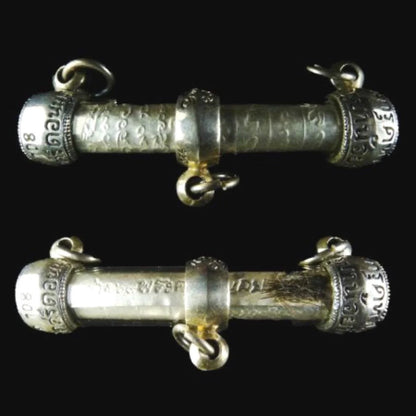 Takrut 108 wealth amulet shown with pendant cord