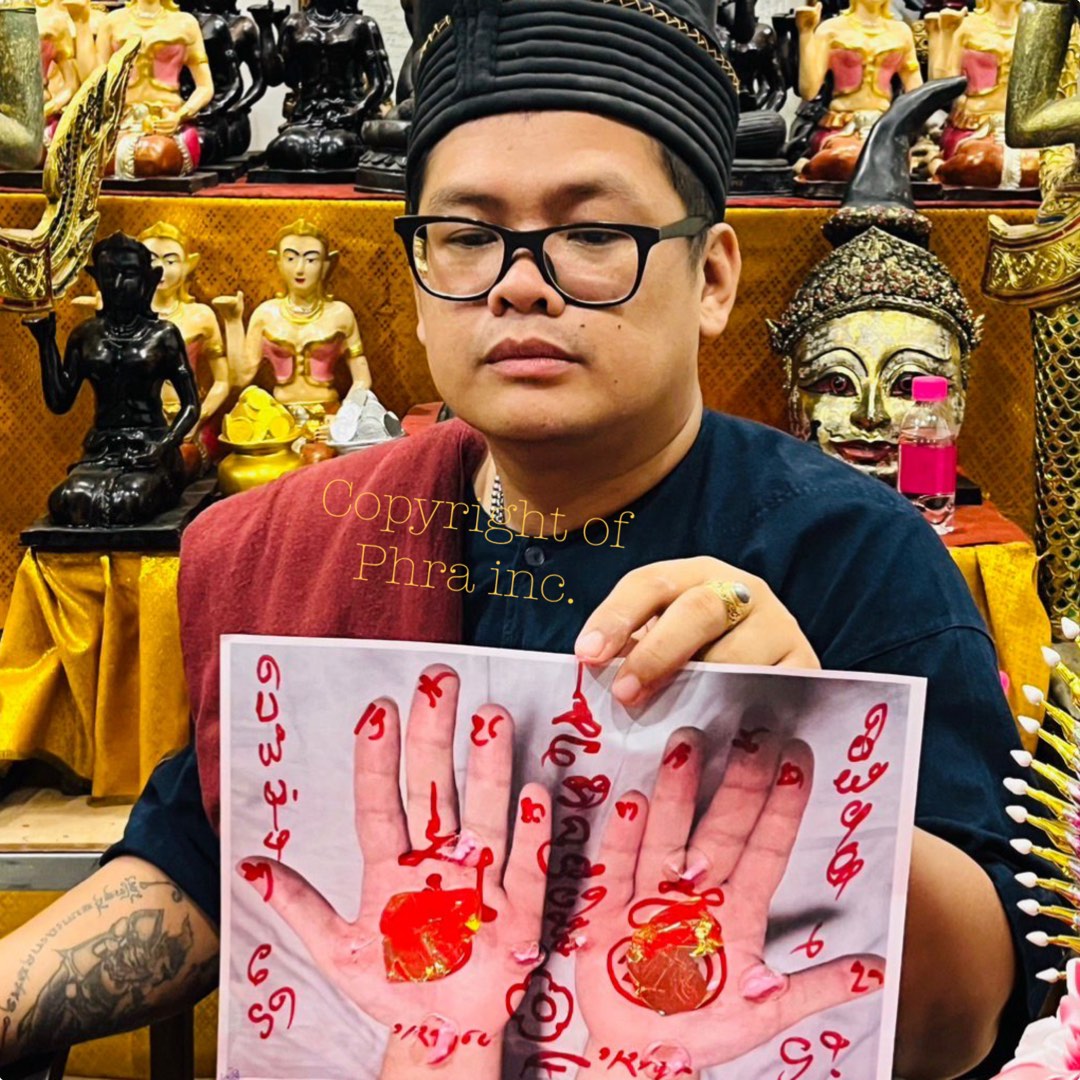Ajarn performing the wealth ritual with the client's photo
