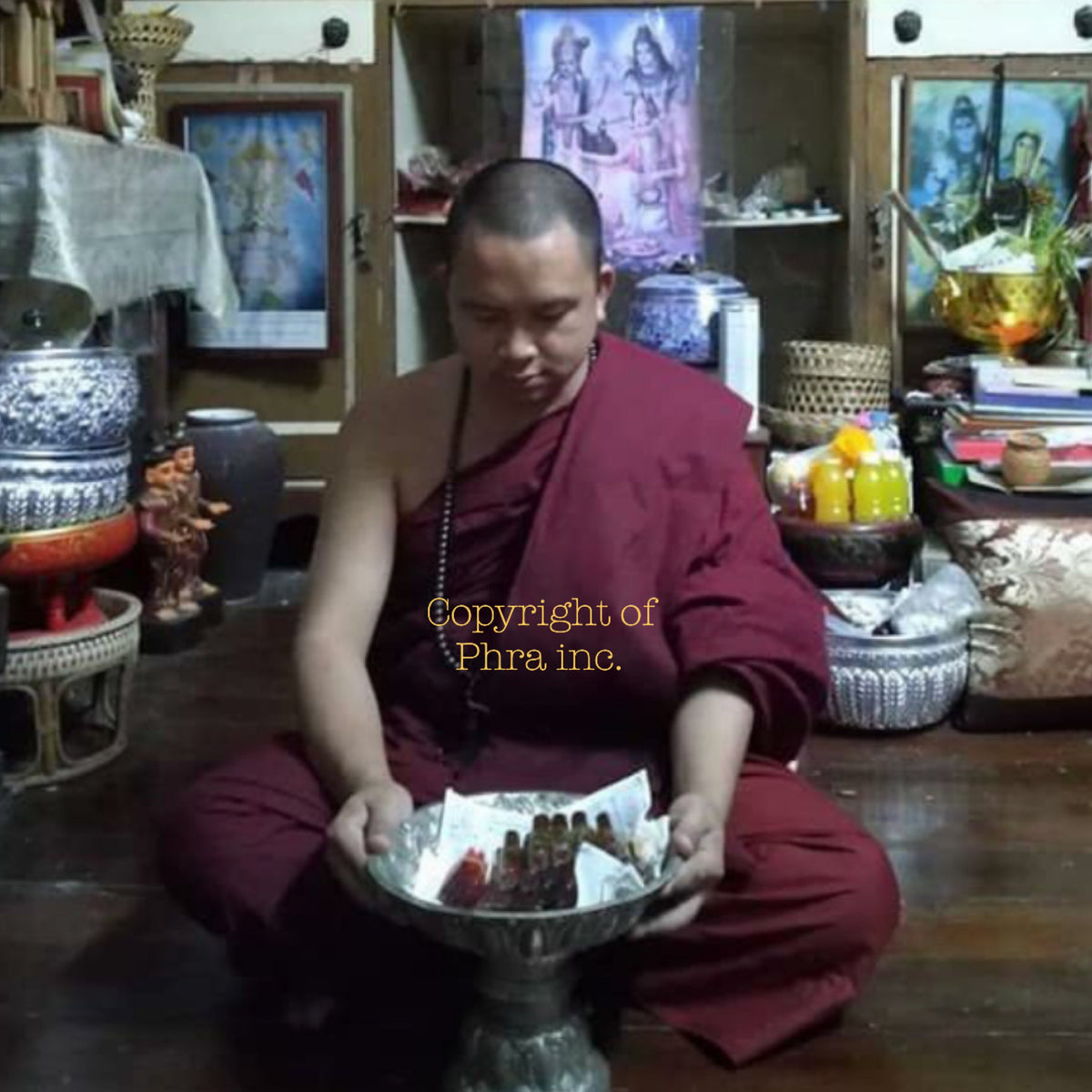 Thai love oil shown in hand for size