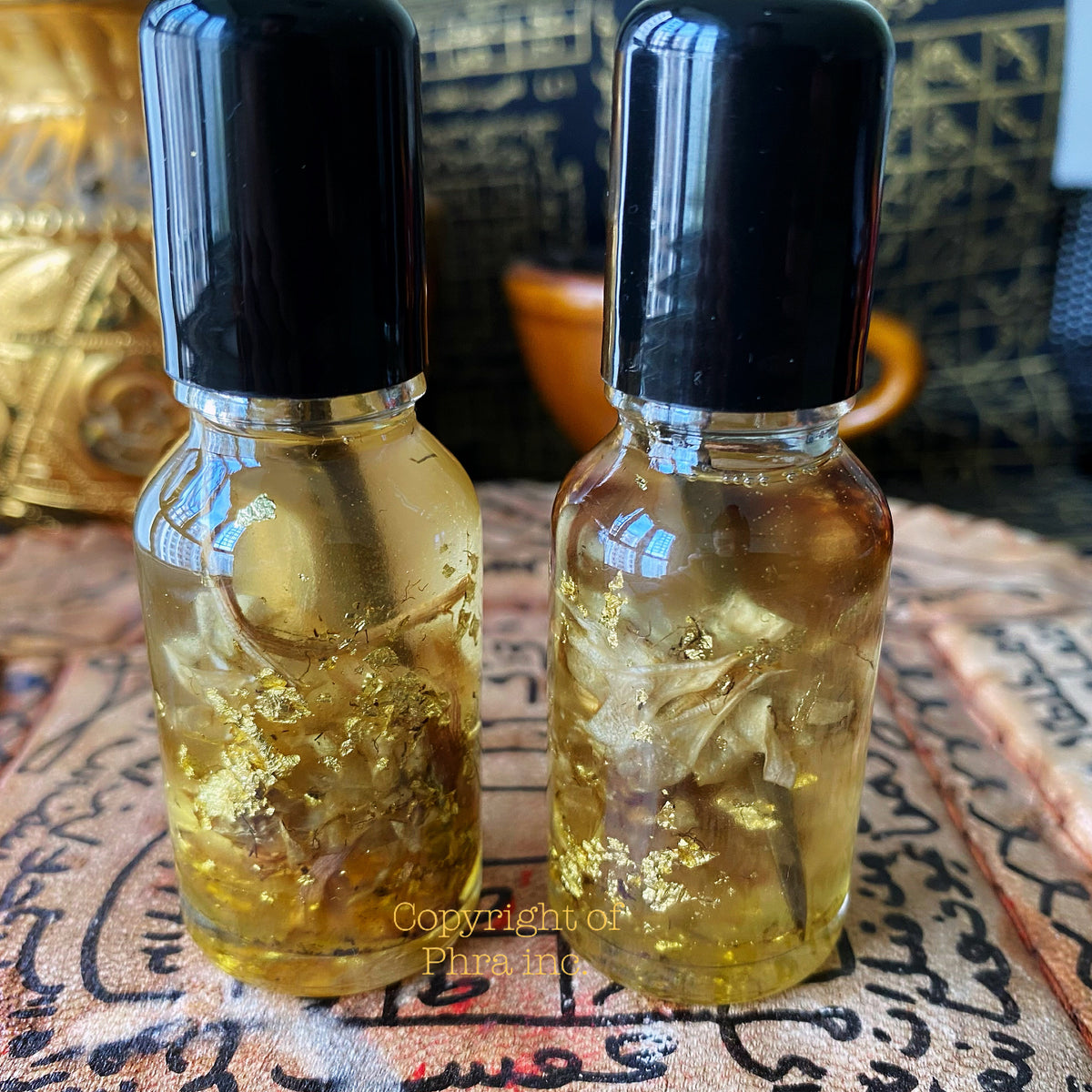 Thai love attraction oil bottle with Wahn Sao Long herb, front view