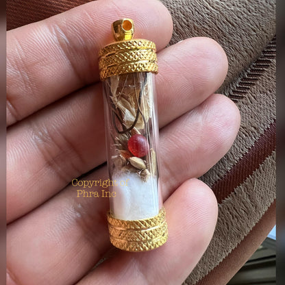 Centipede pearl pendant held in hand for scale