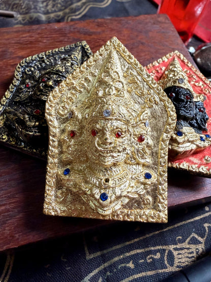 Asura amulet pendant shown with packaging