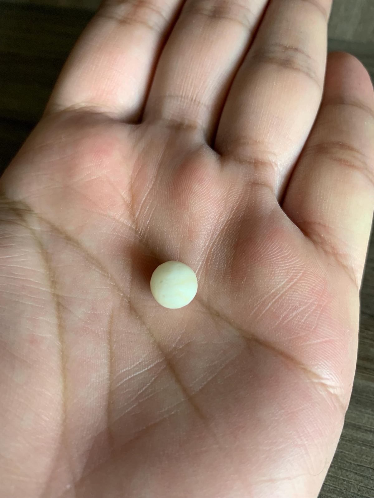 Coconut Pearl ring, top view of the stone