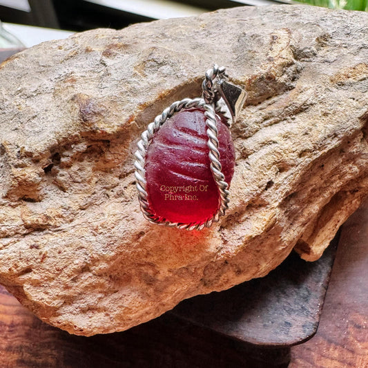 King centipede mustika pearl in a custom silver pendant, front view