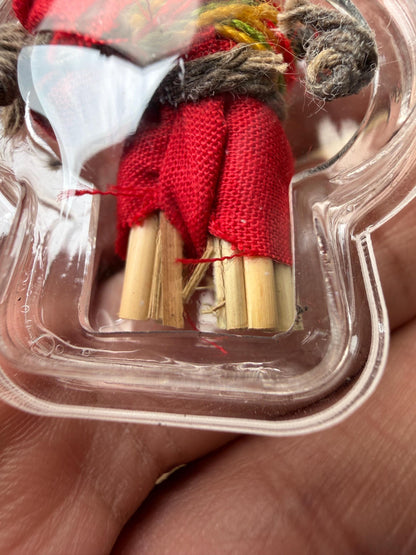 Hoon Payon amulet shown with cord for wearing