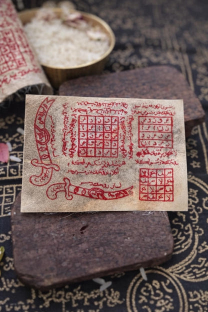 Jackal skin amulet displayed next to its box