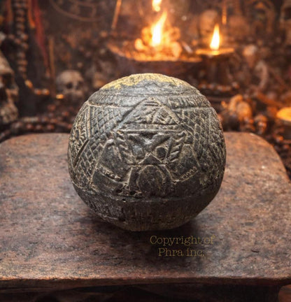 One eye coconut talisman size reference shot