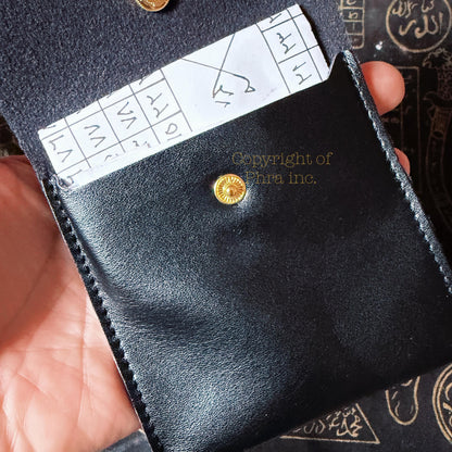 Ritualized wealth taweez shown with its pouch