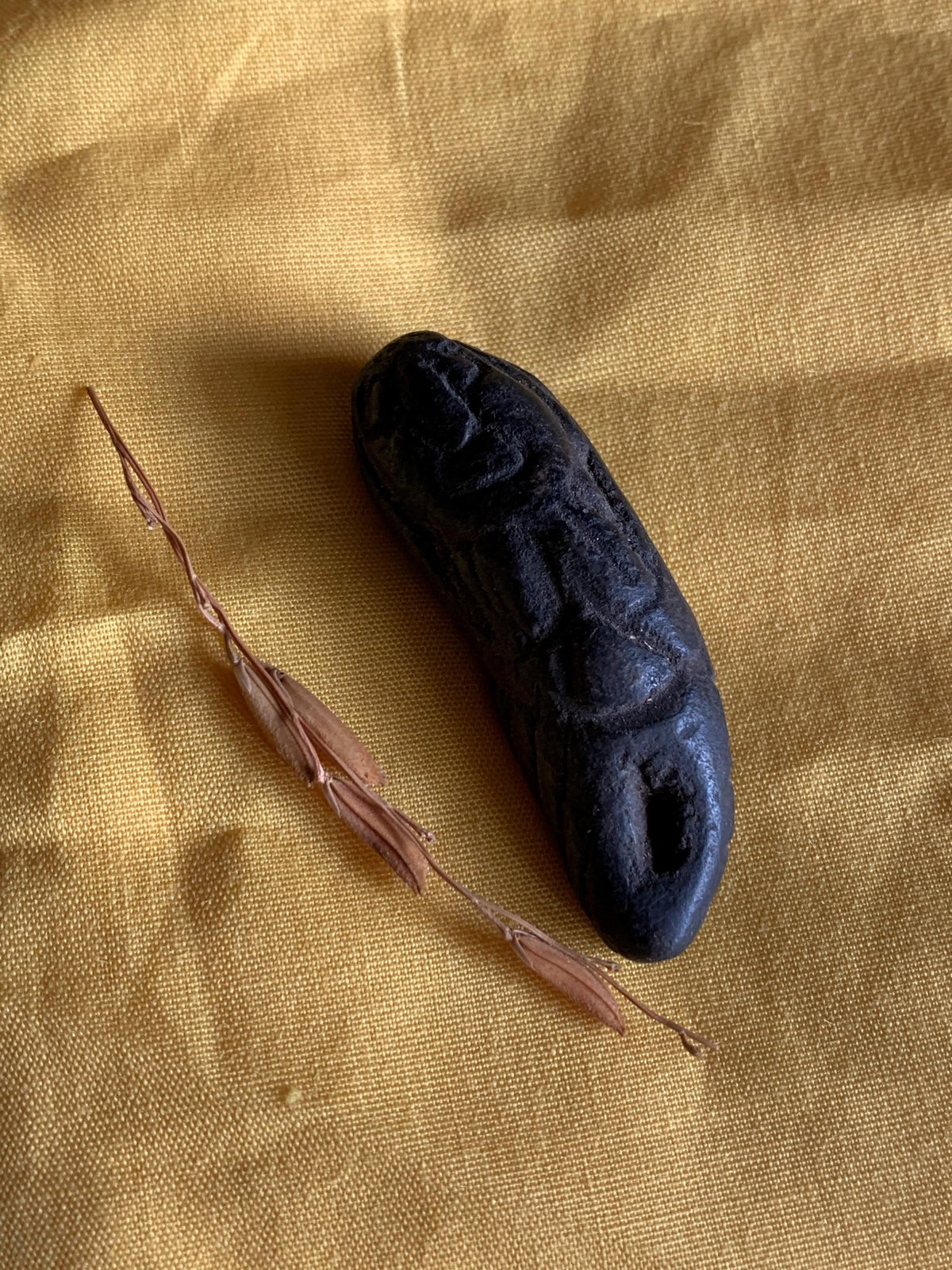 Nini Kantil attraction charm held in hand for scale