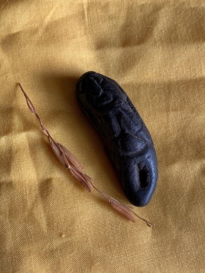 Nini Kantil attraction charm held in hand for scale