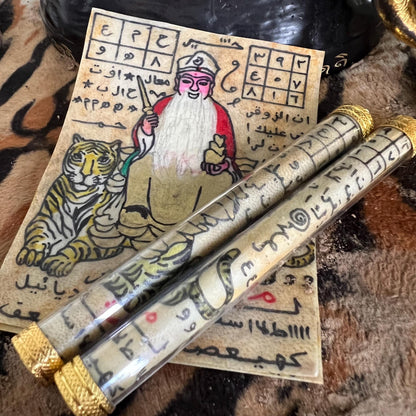 Tiger guardian Datuk amulet showing the inscribed yantras