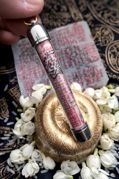 White Tiger takrud talisman shown with cord for wearing