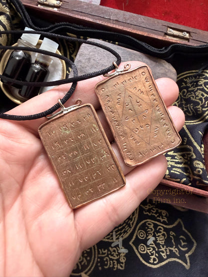 Wealth attraction taweez amulet shown with its cord