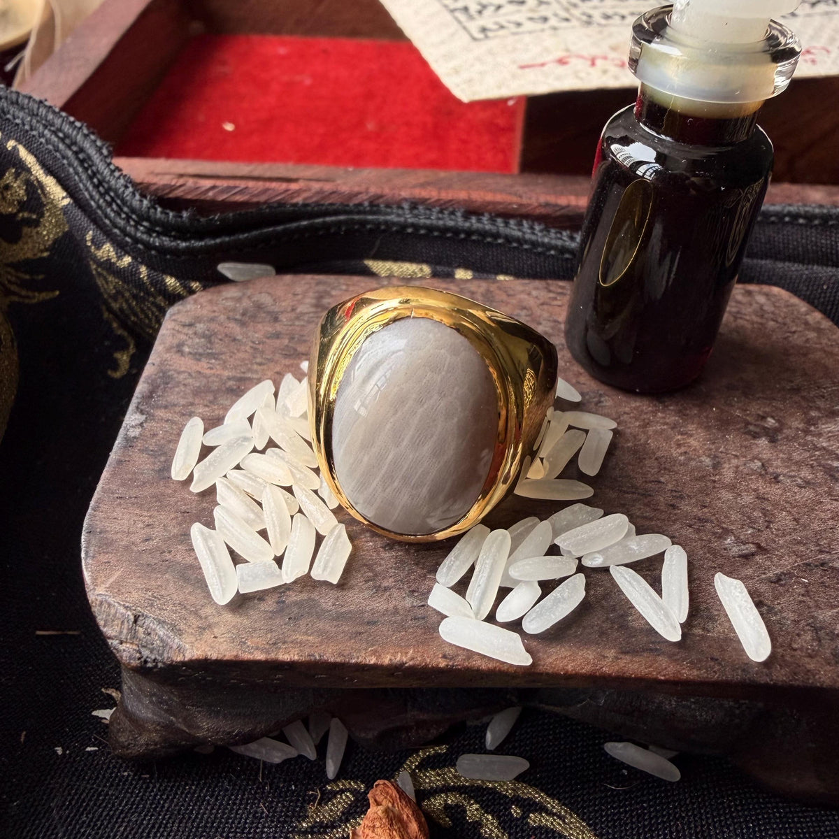 White Nagamani ring with king centipede pearl, angled view