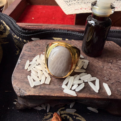 White Nagamani ring with king centipede pearl, angled view