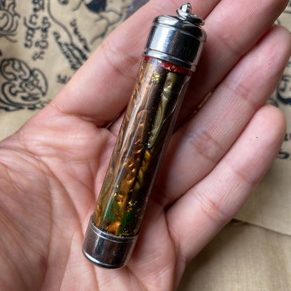 Thai romance takrut amulet, angled view