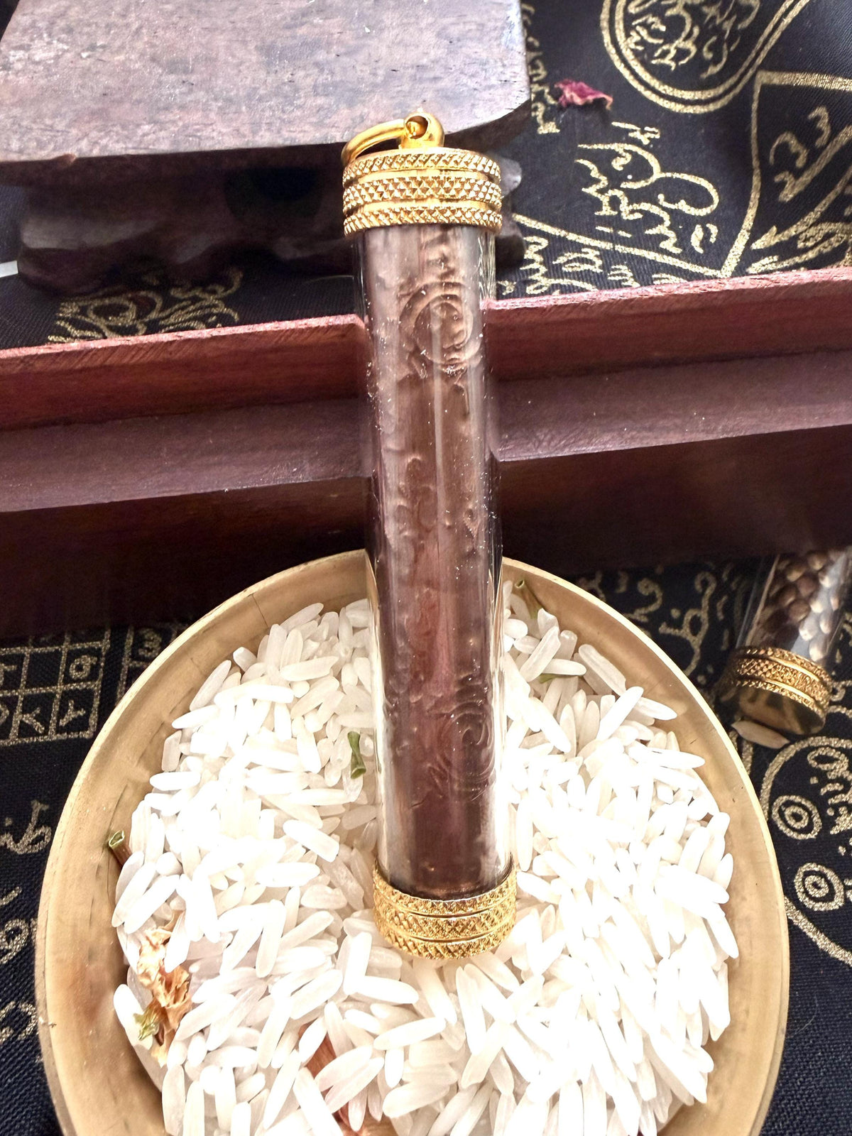Kala Bhairav protection takrut amulet, angled view