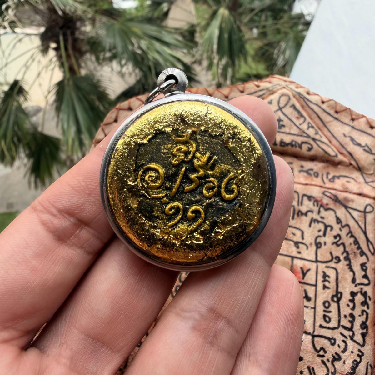 Thao Wahn Long luck and love amulet, back view
