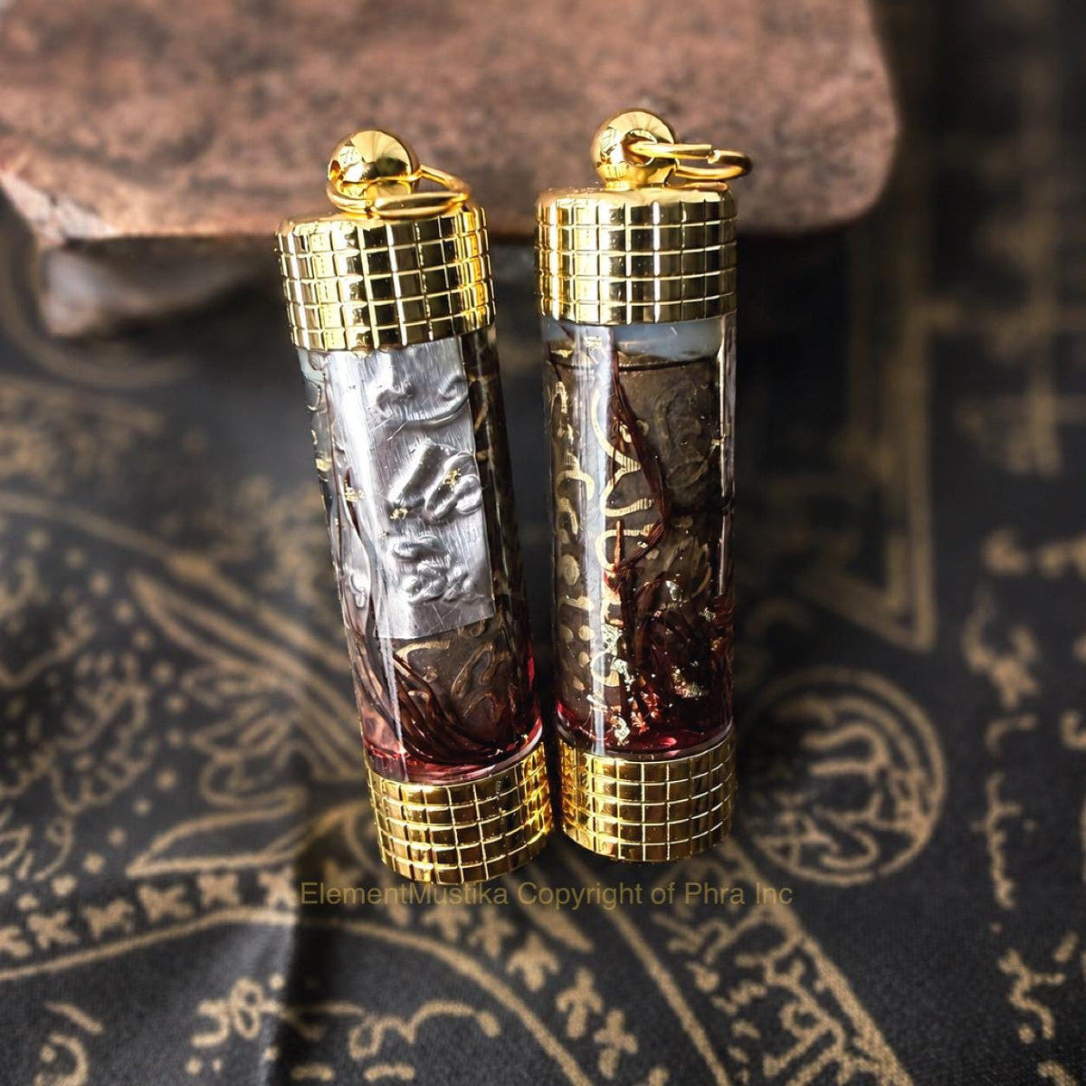Empowered takrut talisman showing the oil-filled capsule