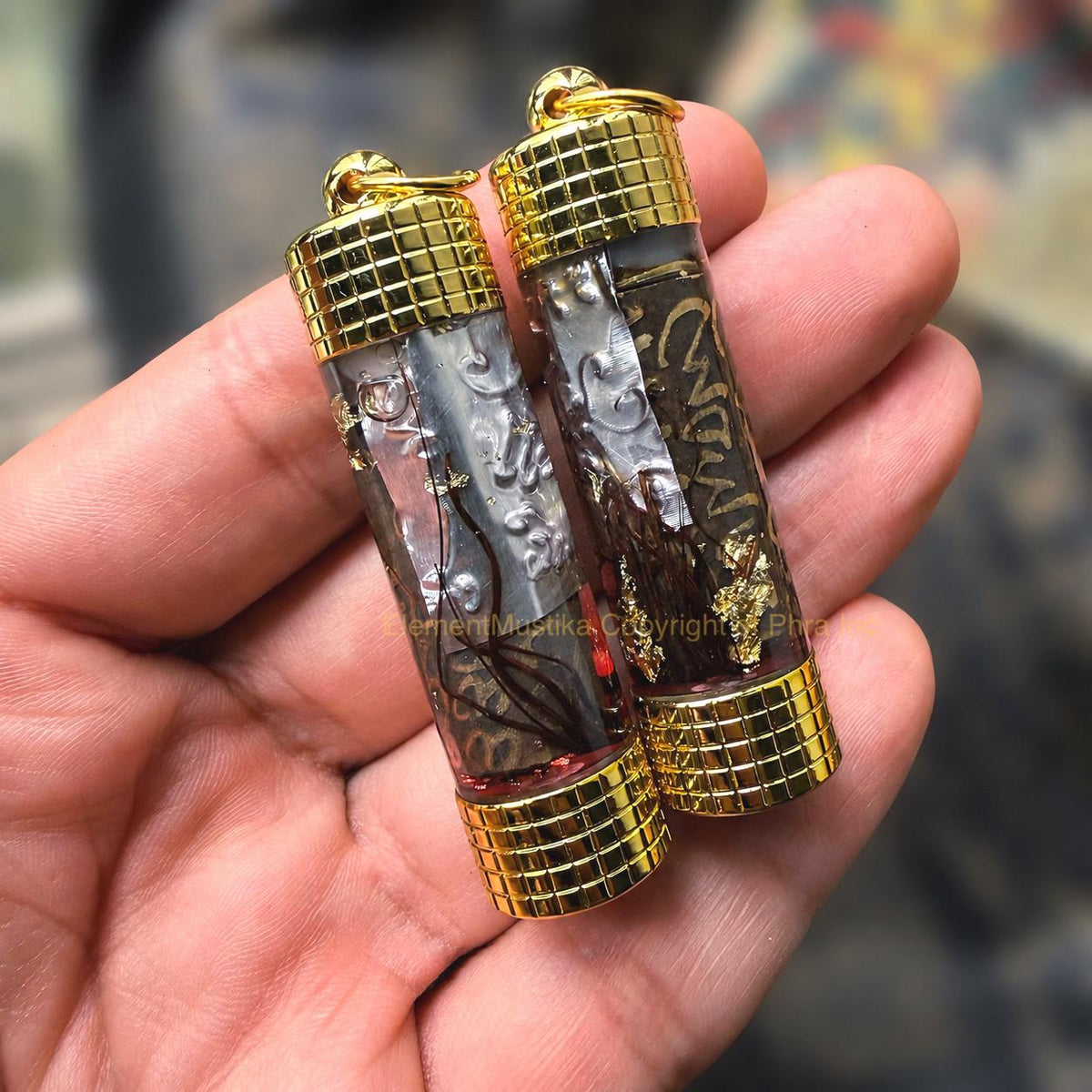 Wealth takrut amulet, angled view