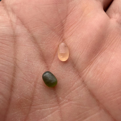 Dew pearl pendant held in hand for size reference