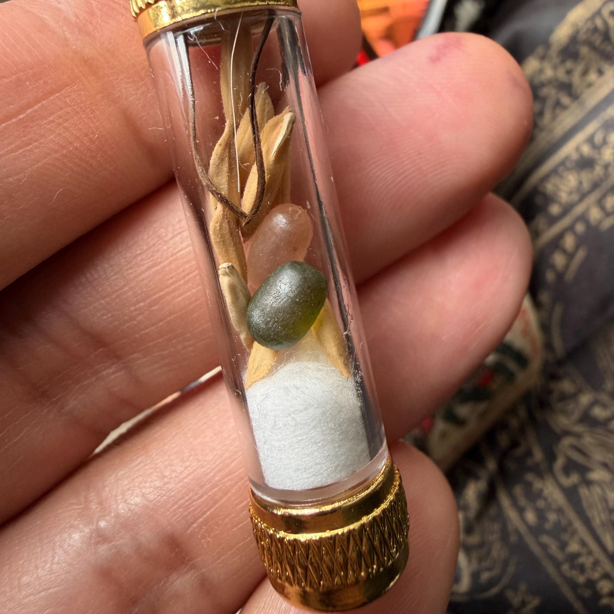 Dew pearl pendant shown with its packaging