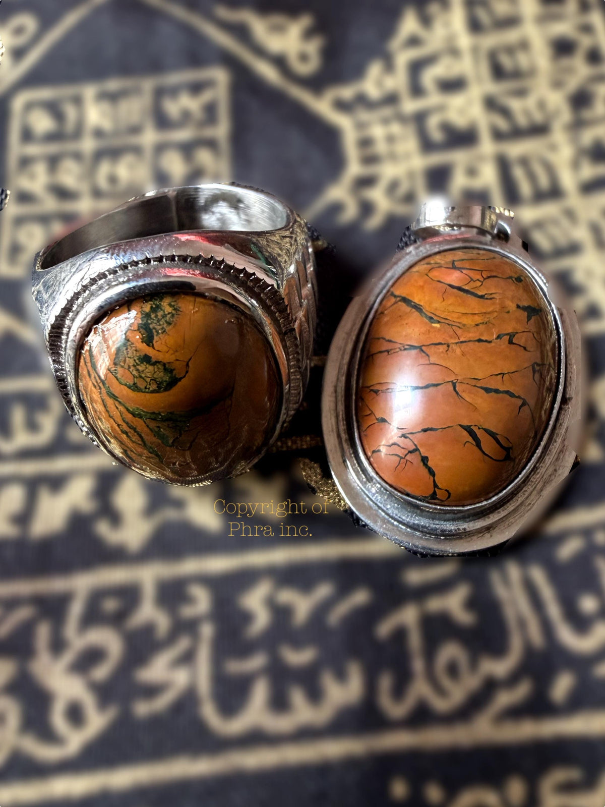 Tiger mustika stone in stainless steel setting, front view