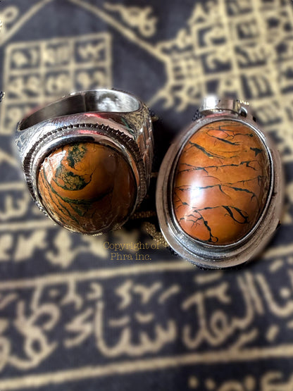 Tiger mustika stone in stainless steel setting, front view