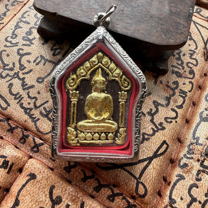 Khun Paen good luck amulet shown at an angle