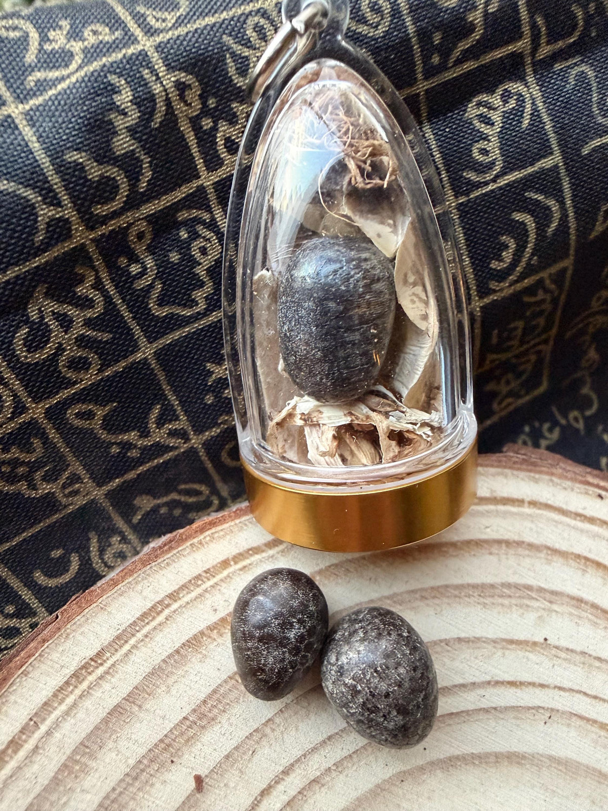 Nagamani cobra crown amulet shown from the side