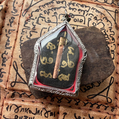 Khun Paen Thai amulet shown with pendant casing