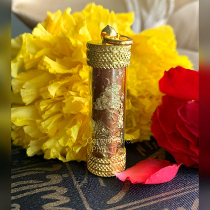 Vashikaran takrut coated with 24K gold flakes, close up