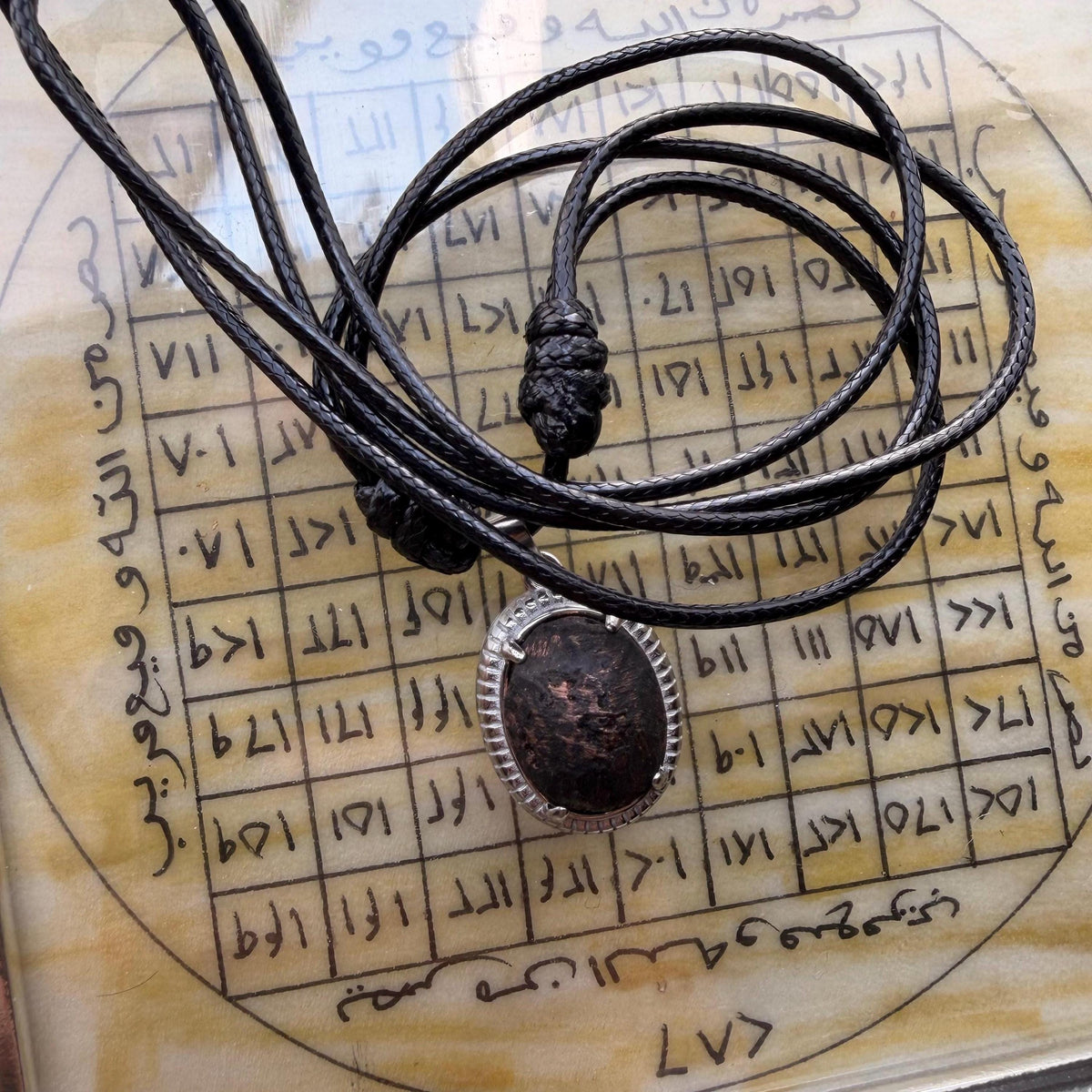 Solomonic throne stone pendant, angled view