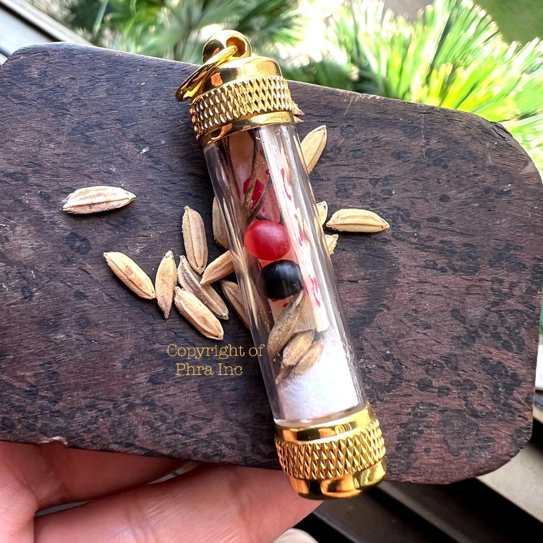 Centipede pearl wealth amulet displayed with its packaging
