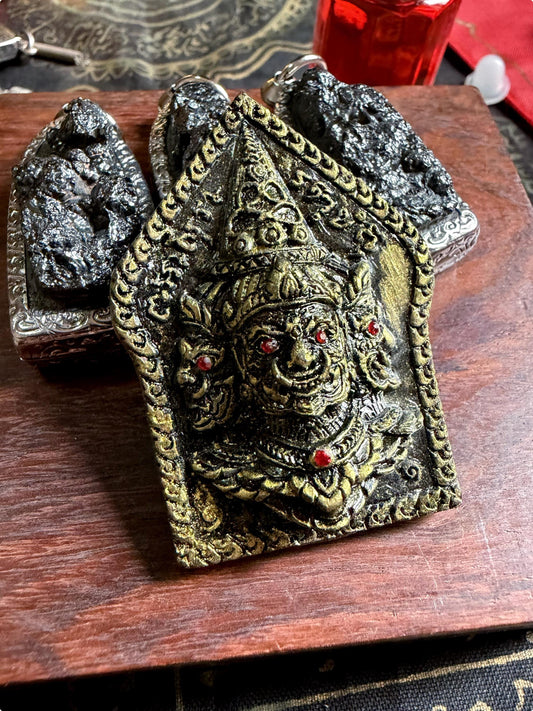 Legendary Asura King amulet, encased and ready to wear, front view