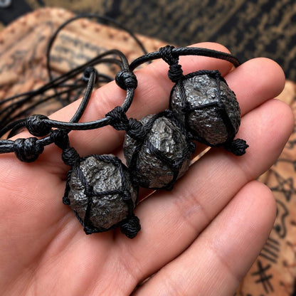 Munta Besi bangle and pendant versions shown together
