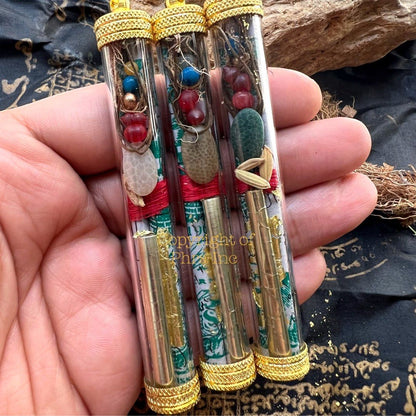 Close-up of the 5 Mustika pearls and Ibu Duit note inside the wealth takrut